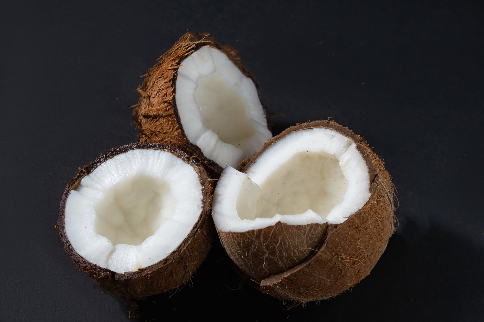 close up photo of cracked coconuts