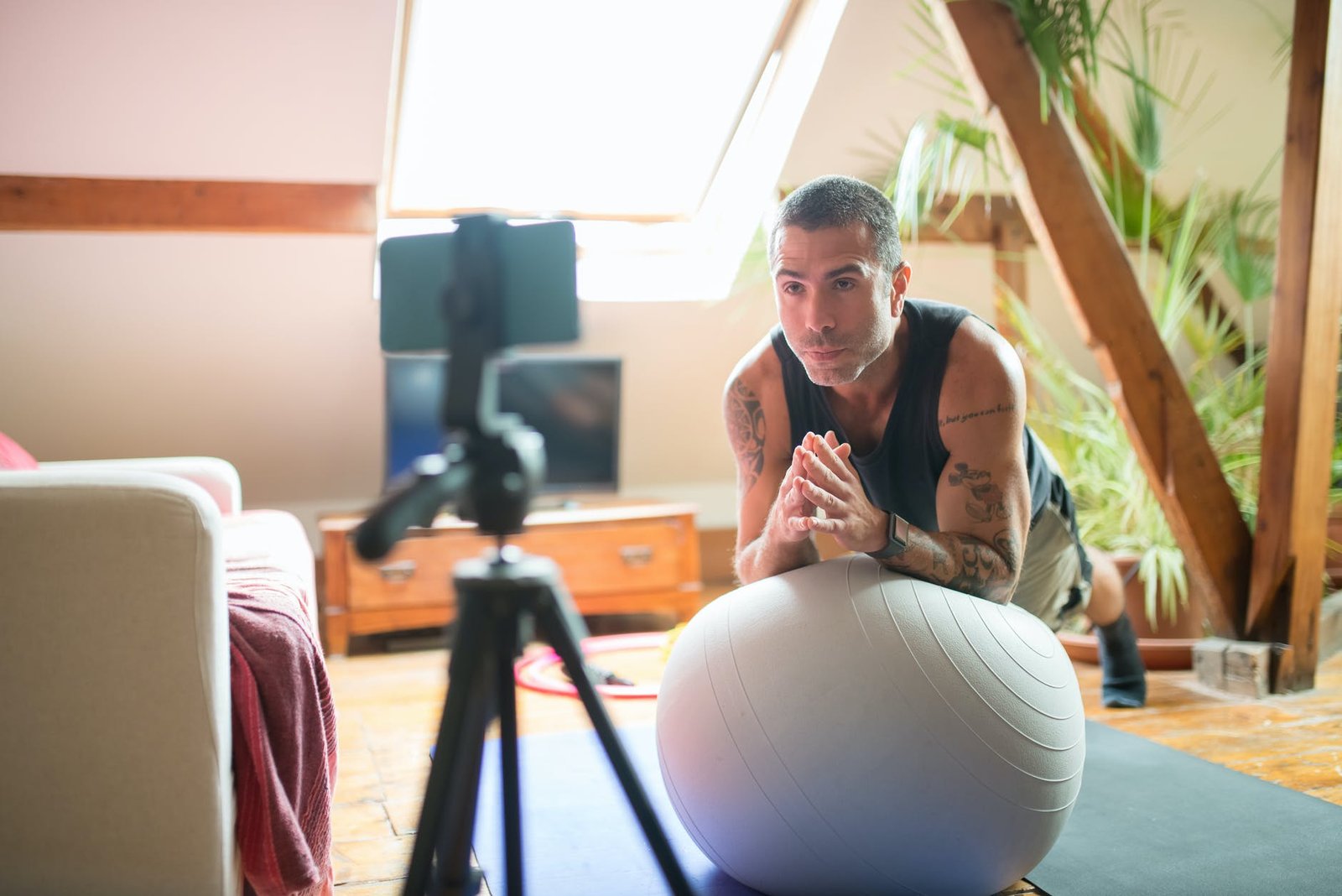 a man using exercise ball - Exercises for Men